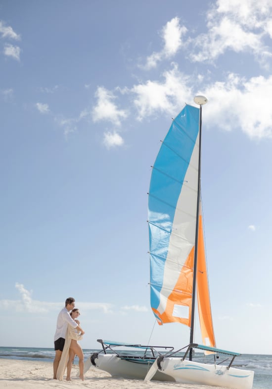 A romantic couple on the beach at Grand Velas Resorts