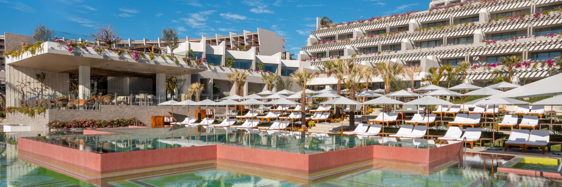 Relaxing poolside scene at Grand Velas Boutique Hotel Los Cabos