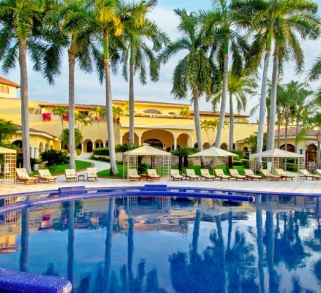 Palm trees encircle the pool at Grand Casa Velas resort in 2005