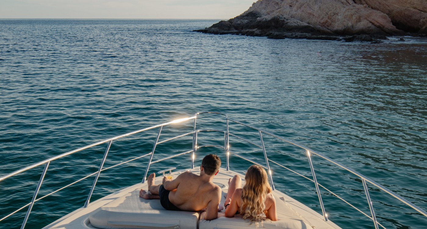 A couple enjoying a boat ride near Grand Velas Boutique Hotel Los Cabos