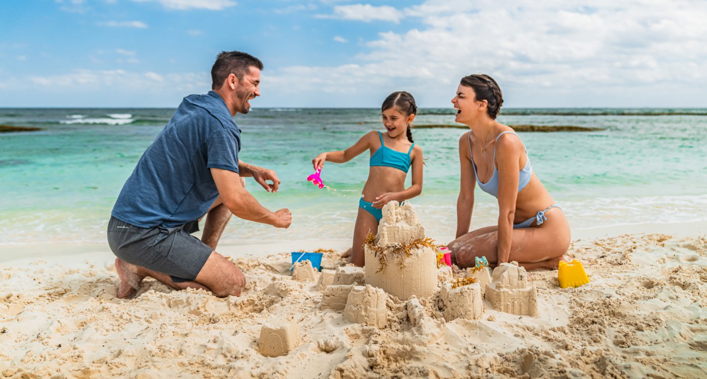 A family enjoying the beach at Grand Velas Riviera Maya